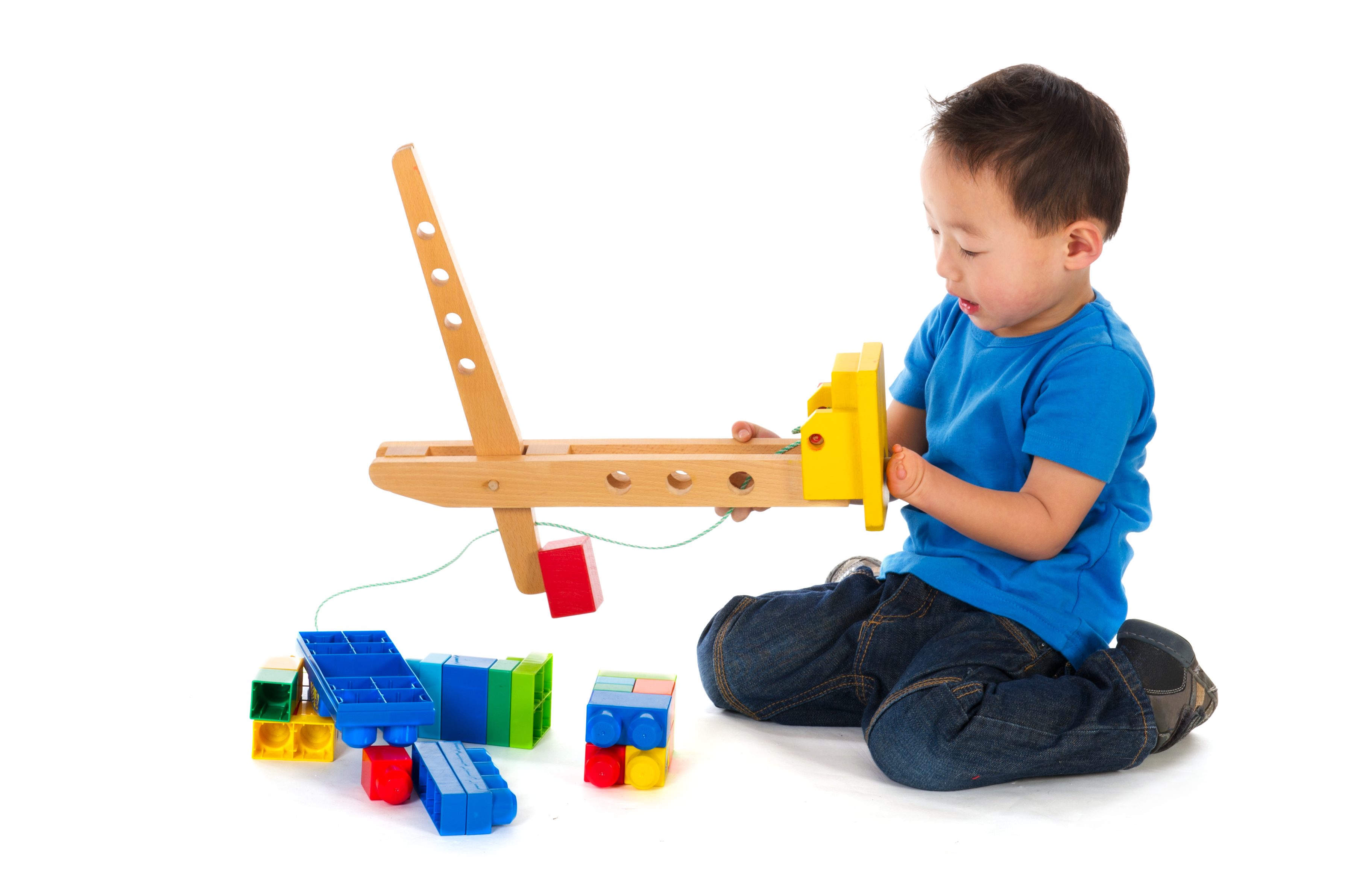 Chinese boy playing with toys