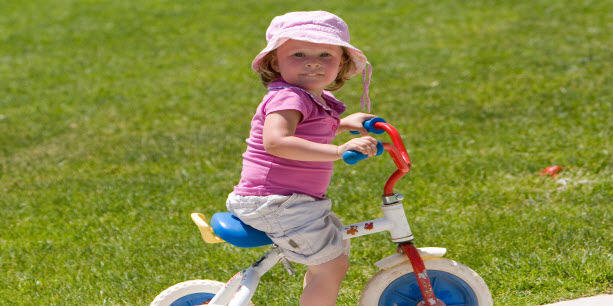 girl on tricycle